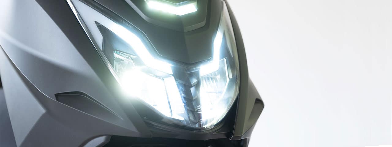 Close up of Rider NG front headlights on